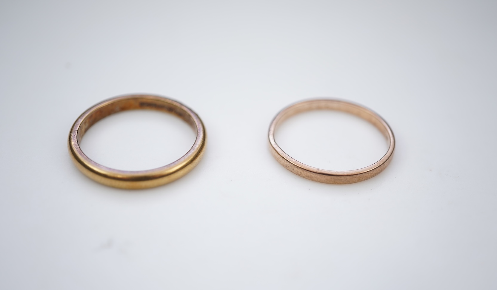 Two gold wedding bands